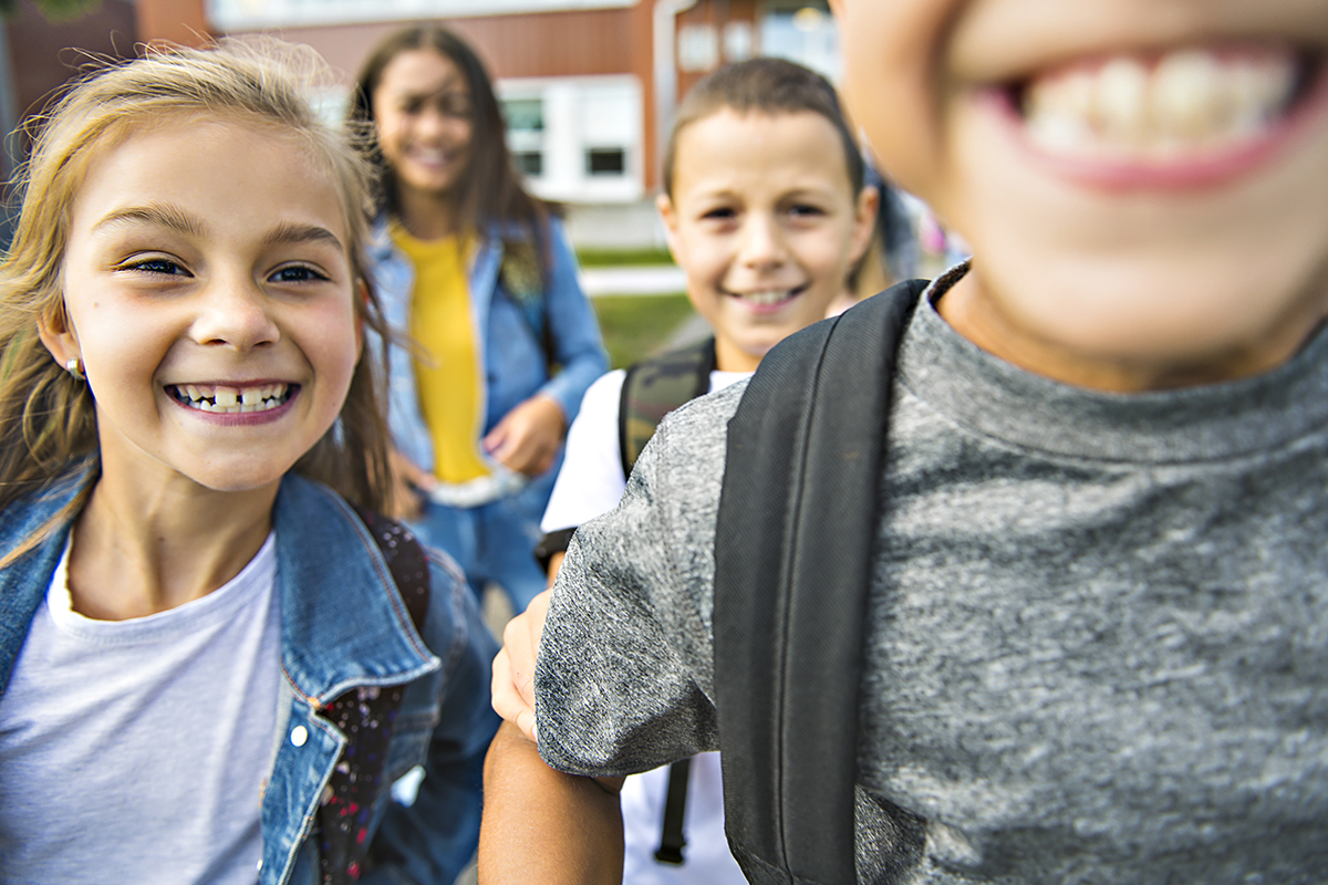 group of kids on the school background having fun