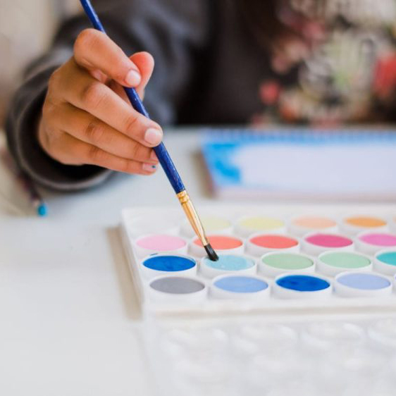 school age boy or girl painting at Von's Kids preschool and child care