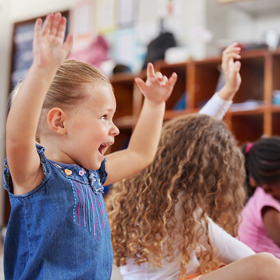 little girl participating in class at Von's Kids preschool